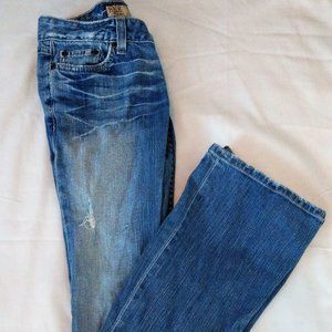 Worn out blue bell bottom jeans